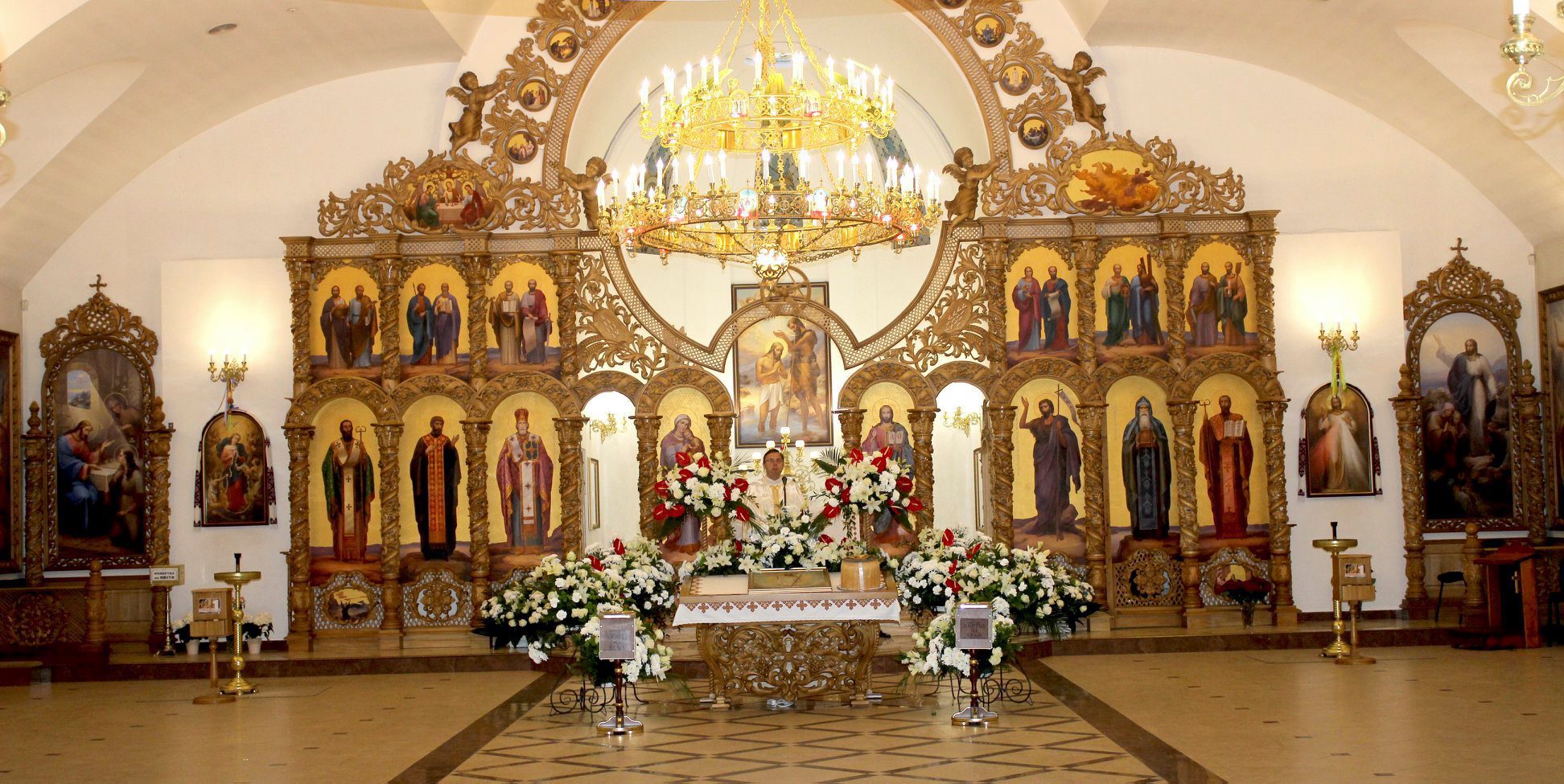 священники